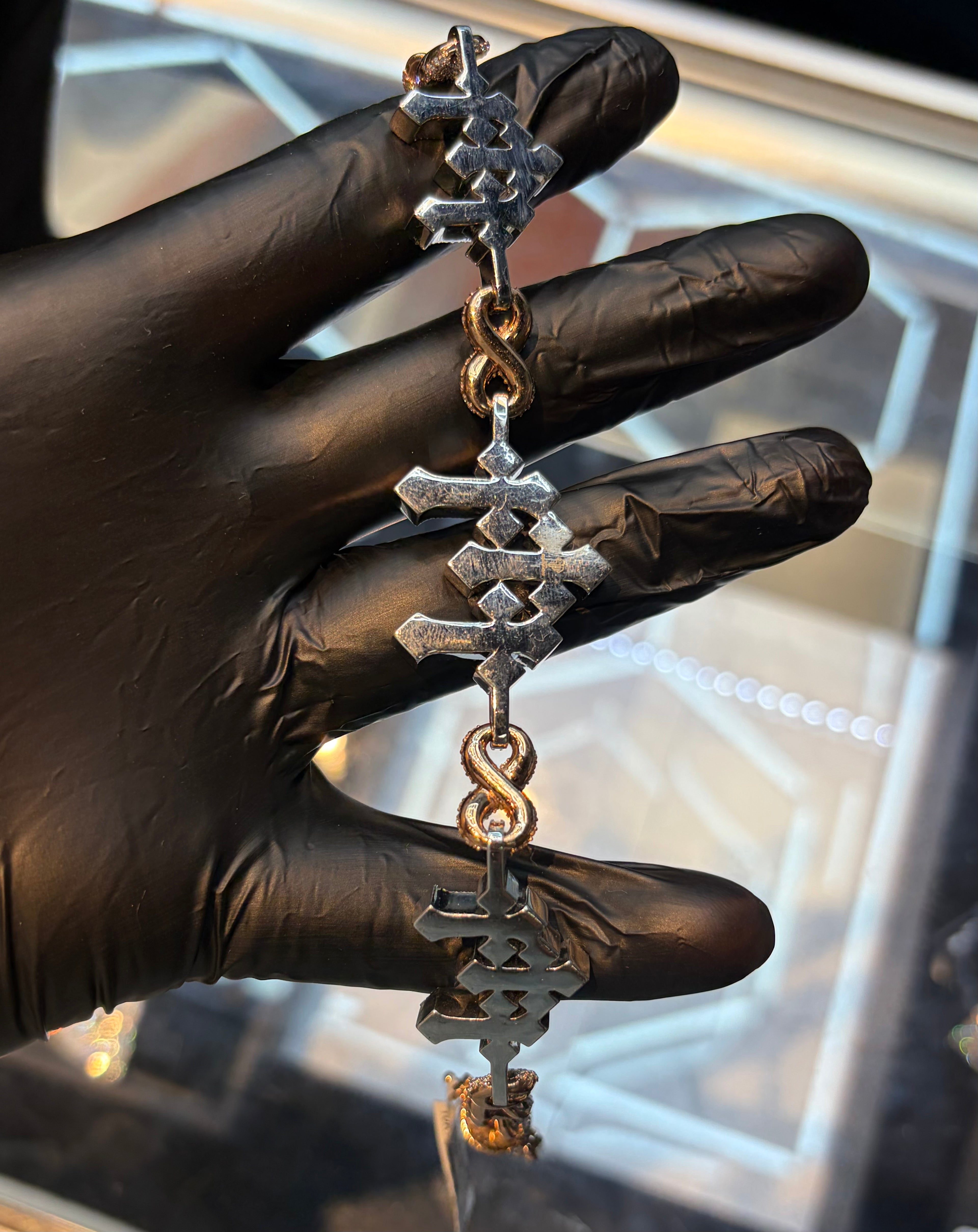 Two Tone Cross Infinity Bracelet